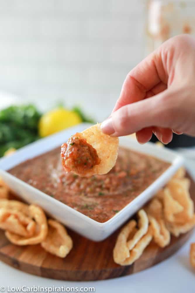 finished blender salsa recipe in a white square bowl with a scoop of homemade salsa